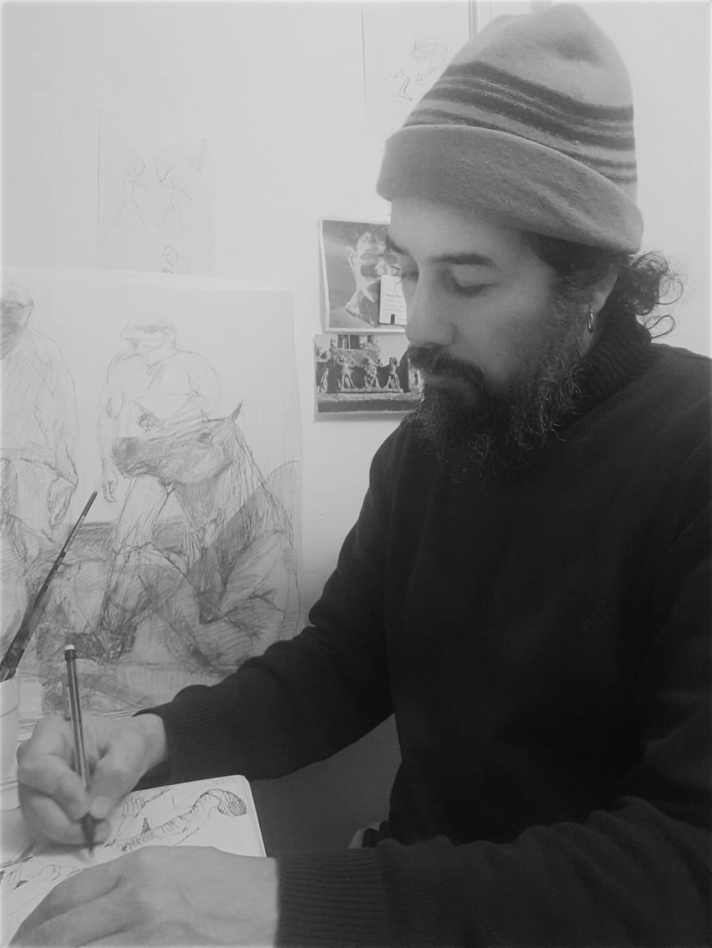 Black-and-white portrait of Ernesto Aníbal Moyano holding an egg